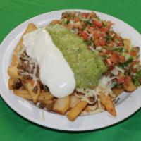 Nacho Fries · French fries topped with refried beans, choice of meat, cheese, sour cream, guacamole and pi...