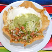 Taco Salad  with Shrimp · Flour tortilla shell with whole pinto beans, lettuce, sour cream, guacamole and salsa,