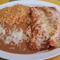 Enchilada Marinas Plate · Flour tortilla rolled with shrimp, topped with red sauce and melted cheese. Served with refr...