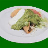 Crispy Taco · Crispy corn tortilla with beans, lettuce, salsa, sour cream, guacamole and cheese.