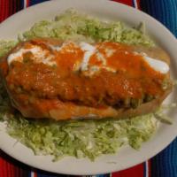 Veggie Chimichanga · Deep fried burrito with rice, beans, cheese, topped with guacamole, sour cream and tomatillo...