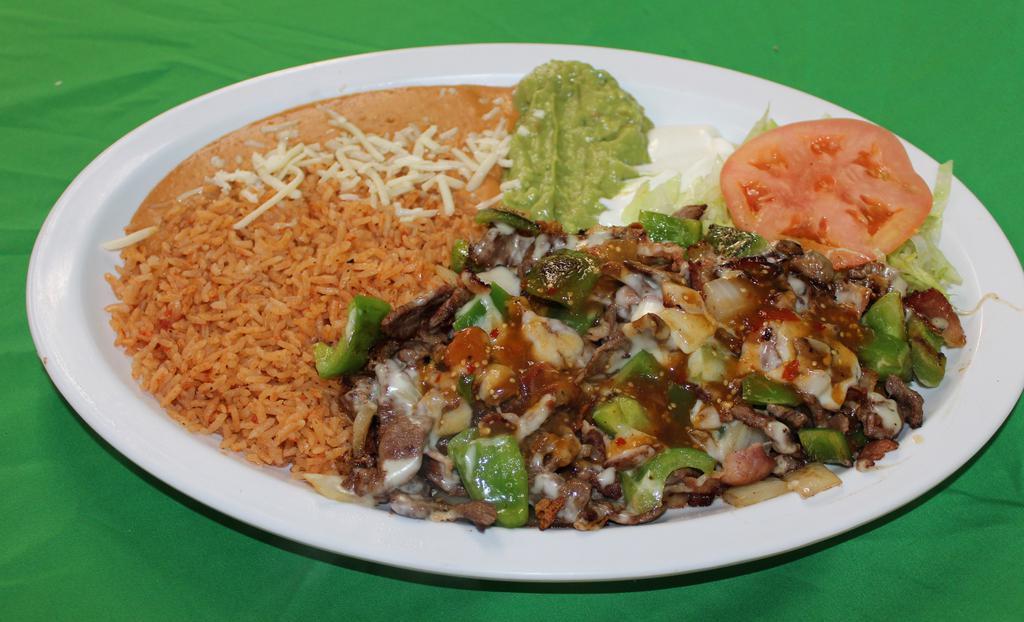 Alambres · Grilled steak, bacon, sauteed with onions, bell peppers. Topped with cheese and tomatillo sauce. Served with rice, re-fried beans, lettuce, sour cream, guacamole and tortillas.