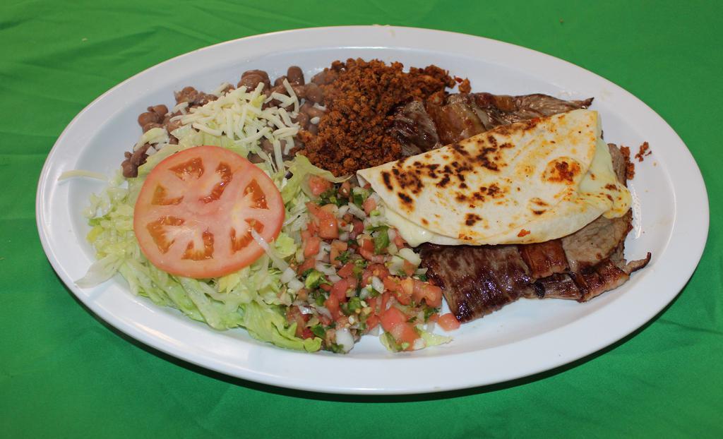 Parrillada Mexicana · 2 carne asada pieces with chorizo, bacon and a flour quesadilla served with bacon, whole pinto beans, rice, lettuce and tomatoe. Includes corn or flour tortillas.
