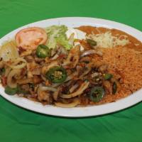 Pollo Ranchero · chicken strips sauteed with jalapeno peppers, onions, tomato and  a special tomatillo sauce....