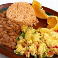 Huevos A La Mexicana · Scrambled eggs, tomato, onion and jalapeño.