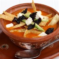Sopa Azteca (Tortilla Soup) · Tomato-pasilla chile broth with tortilla strips, avocado, and cheese.