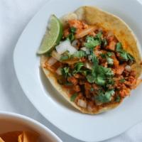 Al Pastor Tacos · Handmade corn tortilla with marinated pork with pineapple. Comes with cilantro, onions, and ...