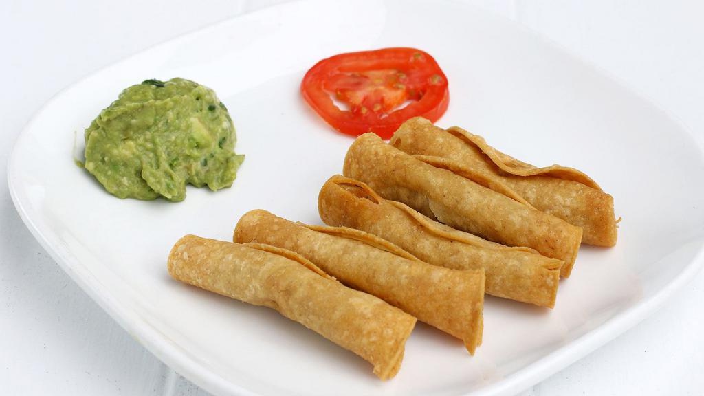 Tacos Dorados · Five crispy rolled corn tortillas filled with chicken. Served with guacamole.