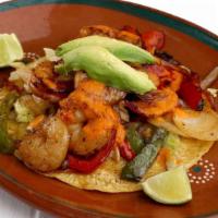 Shrimp Taco · Corn or flour tortilla with grilled shrimp, grilled bell peppers, and onions. Served with av...
