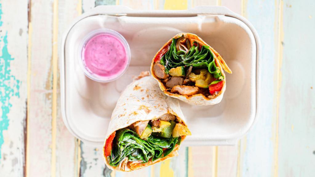 Chicken Wrap · Roasted Turkish marinated organic chicken thighs, roasted seasonal veggies, baby spinach wrapped in warm and freshly made lavash with pepper paste. Comes with sumac yogurt sauce and hot sauce. *Contains dairy and gluten.