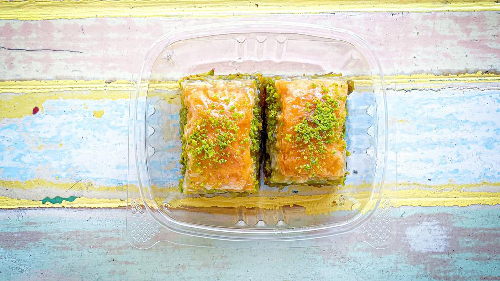 Baklava (2 pcs) · Deliciously rich and buttery Turkish Baklava filled with ground pistachios.
