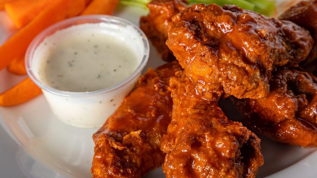 Wings 6 piece · 6 pieces of seasoned and fried chicken wings. Choice of sauce flavors: Traditional Buffalo, Angry Habanero, Sweet Tequila BBQ, Garlic-Parmesan, Lemon-Pepper