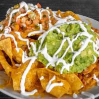 Nachos · Tortilla chips, pinto beans, melted cheese, salsa  fresca,  guacamole and sour cream.

Prote...