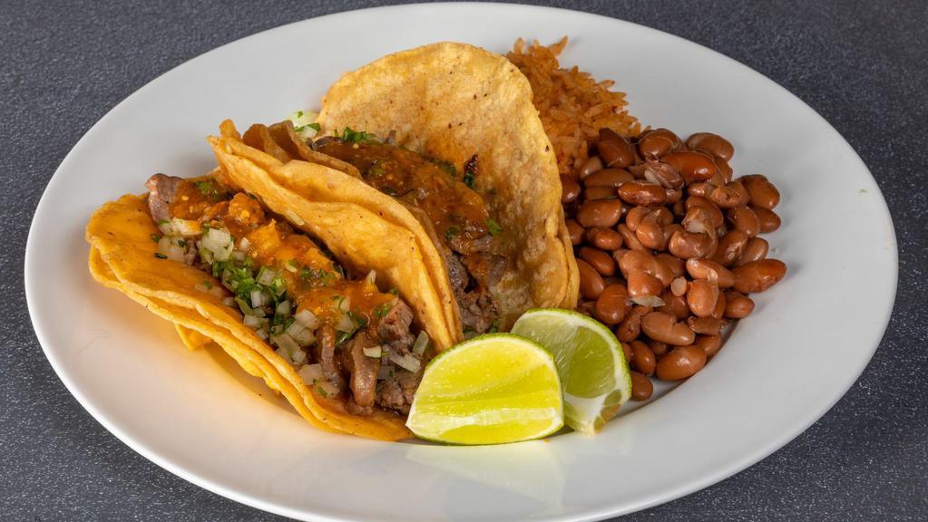 Taco Combo · Two tacos with grilled chicken, carnitas, chile verde or Mexi Veggie with onions and cilantro , and salsa tacos. Served with rice and beans. 

More protein options available for an  additional charge.