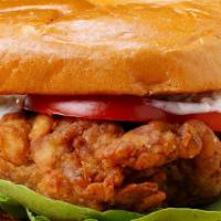 Chicken Burger · Grilled chicken burger with grilled onions, tomato, lettuce, peppers, jack cheese, house mad...