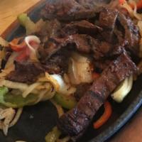 SKIRT STEAK for one · Served with sautéed bell peppers and onions, salsa fresca, sour cream,cheese, guacamole, Me...