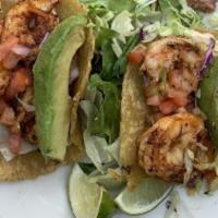 SHRIMP TACOS · Sautéed spicy shrimp in hand-crafted multi-grain tortillas with chipotlecream, lettuce, sal...
