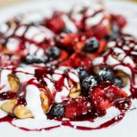 Blintzes with Fresh Berries · Our own special ricotta cheese filled blintzes, crepes, covered with fresh berries, served w...