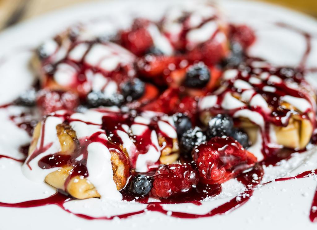 Blintzes with Fresh Berries · Our own special ricotta cheese filled blintzes, crepes, covered with fresh berries, served with raspberry sauce and chantilly sauce.