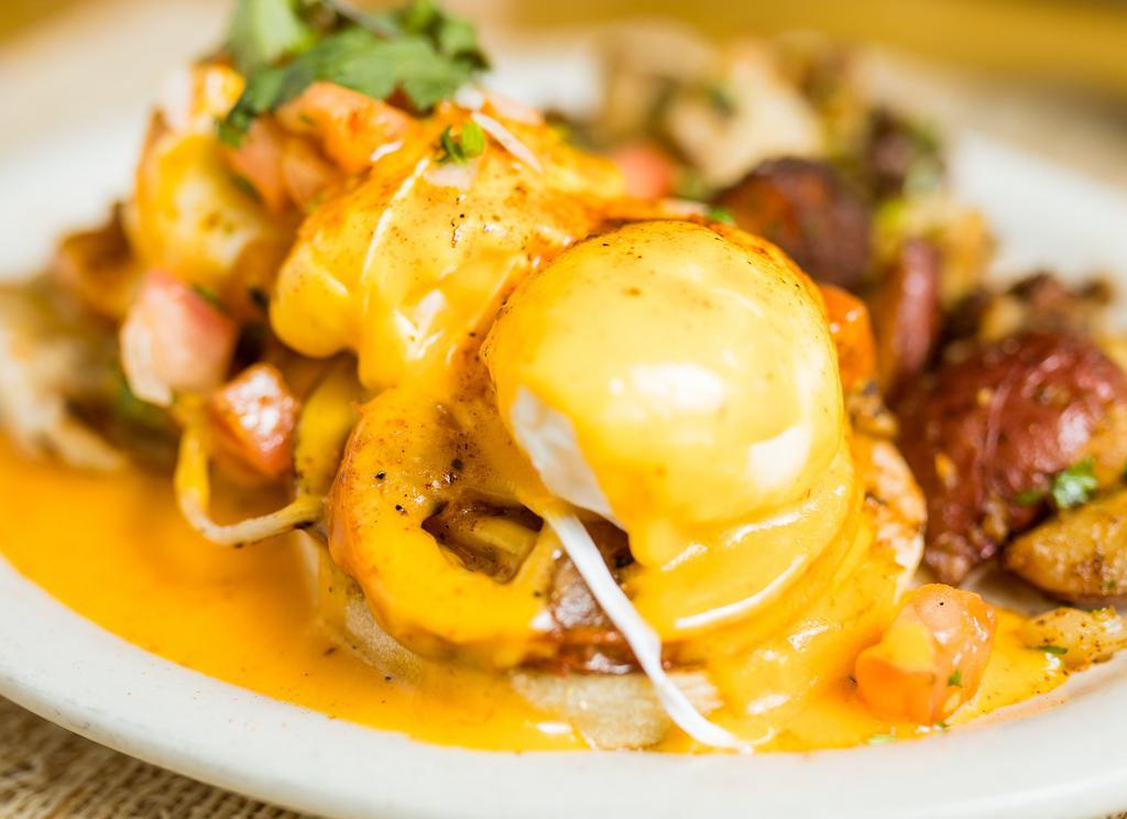 Santa Fe Benedict · Grilled onion, tomato, avocado with spicy hollandaise sauce.
