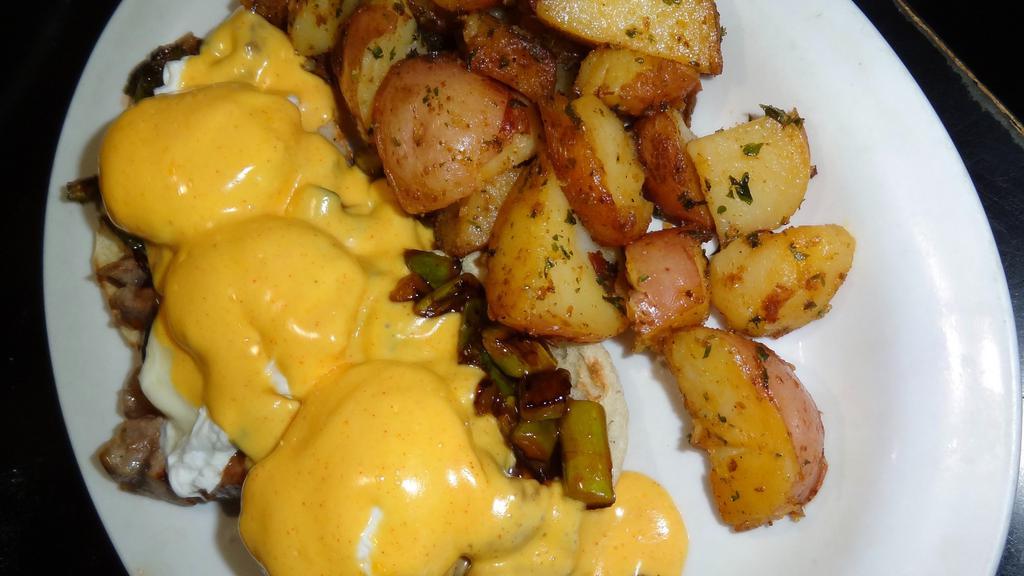 Irish Benedict · Our house made corned beef hash. English muffin and Hollandaise sauce.