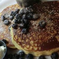 Blueberry Wheatgerm Pancakes · Filled and topped with fresh blueberries and wheatgerms.