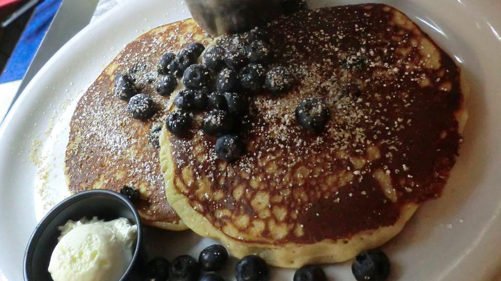 Blueberry Wheatgerm Pancakes · Filled and topped with fresh blueberries and wheatgerms.