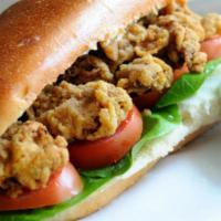 Fried Clam Po'boy · High in protein and Vitamin B12, our deep fried clam strips is topped with lettuce and tomat...