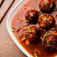 Vegetable Manchurian · Deep fried vegetable balls cooked in a special garlic and soy sauce gravy.