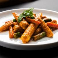 Chilli Baby Corn · Crispy baby corn cooked with chillies, bell pepper and soya sauce.