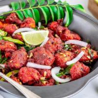 Chicken 999 · Boneless chicken fried and tossed with green chilies, curry leaves and extra spices.