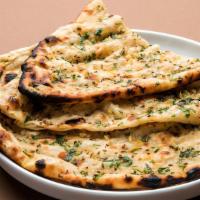 Olive Naan · Traditional Punjabi leavened white bread topped with olive and baked in our clay oven.