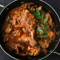 Dhaba Chicken Curry · Boneless chicken marinated with salt, ginger garlic paste, and lemon juice is then cooked wi...