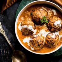 Malai Kofta · Deep fried dumplings made with mix vegetables, Cottage cheese, dry fruits cooked in a creamy...