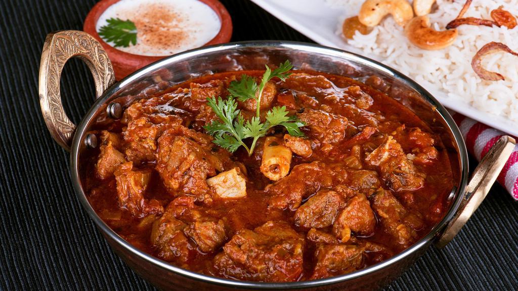 Nizami Goat Curry · Special goat curry cooked on slow fire with fresh spices and roasted onion sauce.
