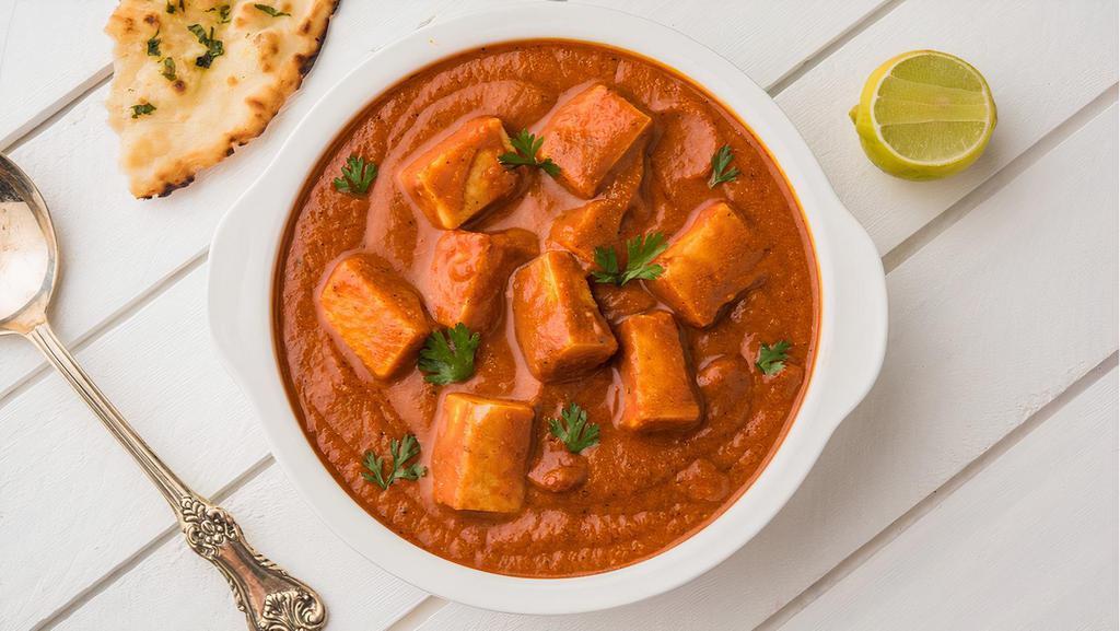 Paneer Tikka Masala · Marinated paneer cheese served in a spiced gravy cooked with cream and tomatoes fused with garam masala.