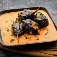 Eggplant Curry · South Indian style tangy curry cooked with small eggplants, onions, tomato and special spices.