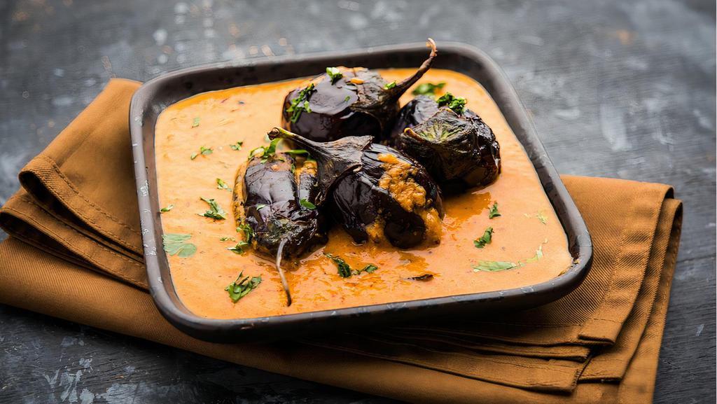 Eggplant Curry · South Indian style tangy curry cooked with small eggplants, onions, tomato and special spices.