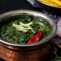 Saag Pasand Se · Punjabi style curry made with garden fresh spinach cooked with garlic and heavy cream.