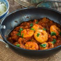 Shrimp Korma · Marinated 31 to 40 size of shrimp cooked in coconut, pappy seeds, tomatoes, onions and speci...