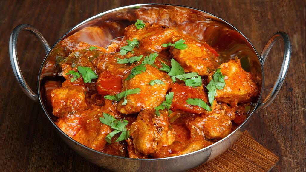 Amritsari Mutton Tikka Masala · Oven grilled chicken breast cooked in onion, tomato sauce, house-made yogurt and spices.