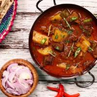 Lamb Aloo · Boneless lamb cubes cooked with tomatoes, onions, ginger garlic paste, bay leafs, potatoes a...