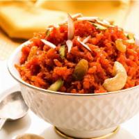Gajar Halwa · Grated carrots cooked with milk, sugar, and nuts.