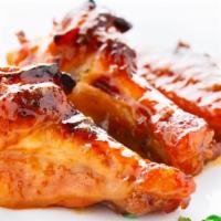 Halal Honey Garlic Wings · Fresh halal chicken wings smothered in a batch with honey garlic sauce.