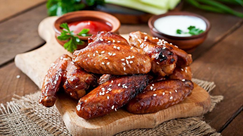 Halal Teriyaki Wings · Warm teriyaki sauce smothered on sizzling halal chicken wings and served.
