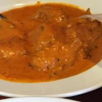 Butter Chicken · Marinated, oven baked in a delicious creamy sauce.