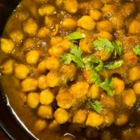 Chana Masala · Garbanzo cooked in a spiced sauce.