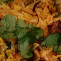 Vegetable Biryani · Veggie. Vegetables in basmati rice, garnished with fried onions and dhania pata.
