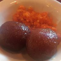 Gulab Jamun · Deep fried dough served in sugar syrup flavored with rose water.