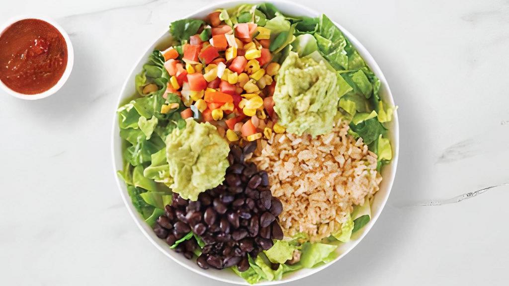 California Bowl · Double guacamole, black beans, brown rice, lettuce, roasted corn and mild salsa.
